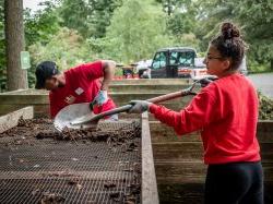 Two students with a shovel on 9/11 Day of Service